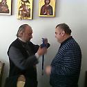 Bishop Vasilije presents Order of Saint Sava to Mr. Zoran Stevanovic