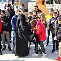 Patriarch with children from the region at Saint Sava Cathedral church